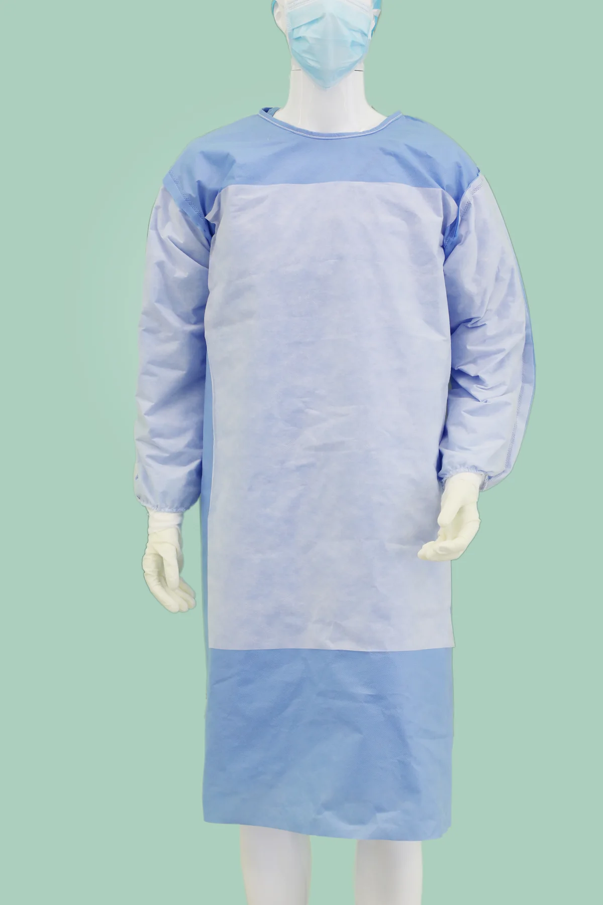 Real reinforced surgical gown showing the front reinforcement panel