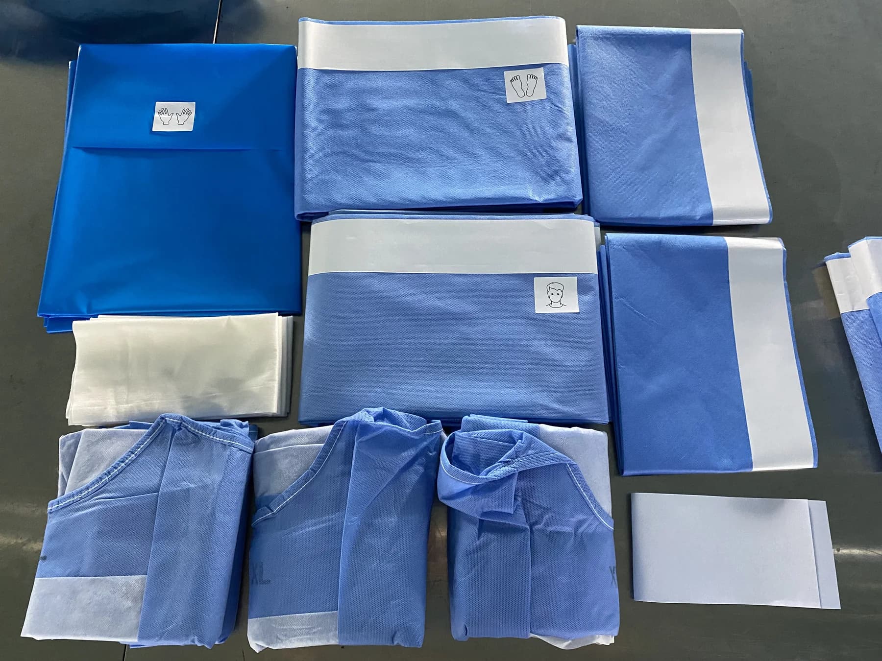 Real surgical pack drapes and components arranged for specification review